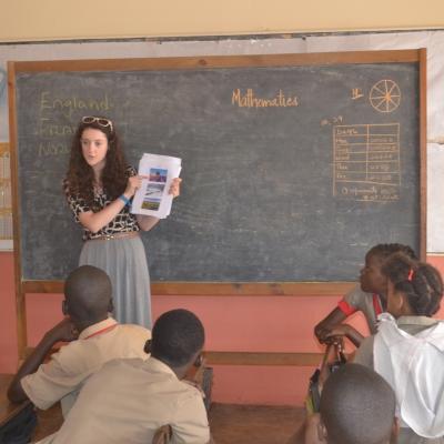 A Human Rights intern in Jamaica talks to students at a primary school during an outreach activity. A Human Rights intern in Jamaica gains work experience during an outreach.